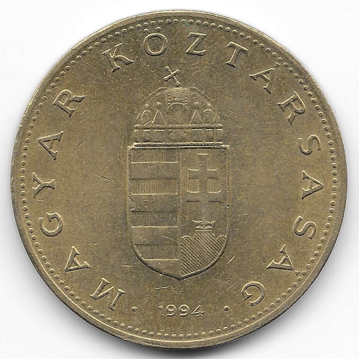 Régi, egyszínű sárga 100 forintos érme 1994-es évszámmal, a koronás címerrel és Magyar Köztársaság felirattal